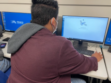 Student working on a graphics project.
