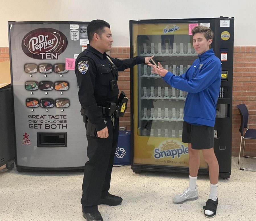 Officer+Kim+pointing+to+empty+vending+machine.