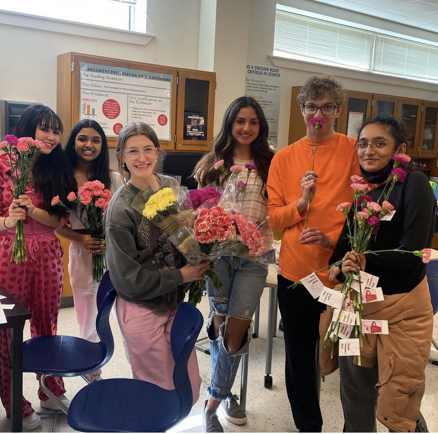 Student Council promoting kindness by delivering flowers to their teachers and students.
