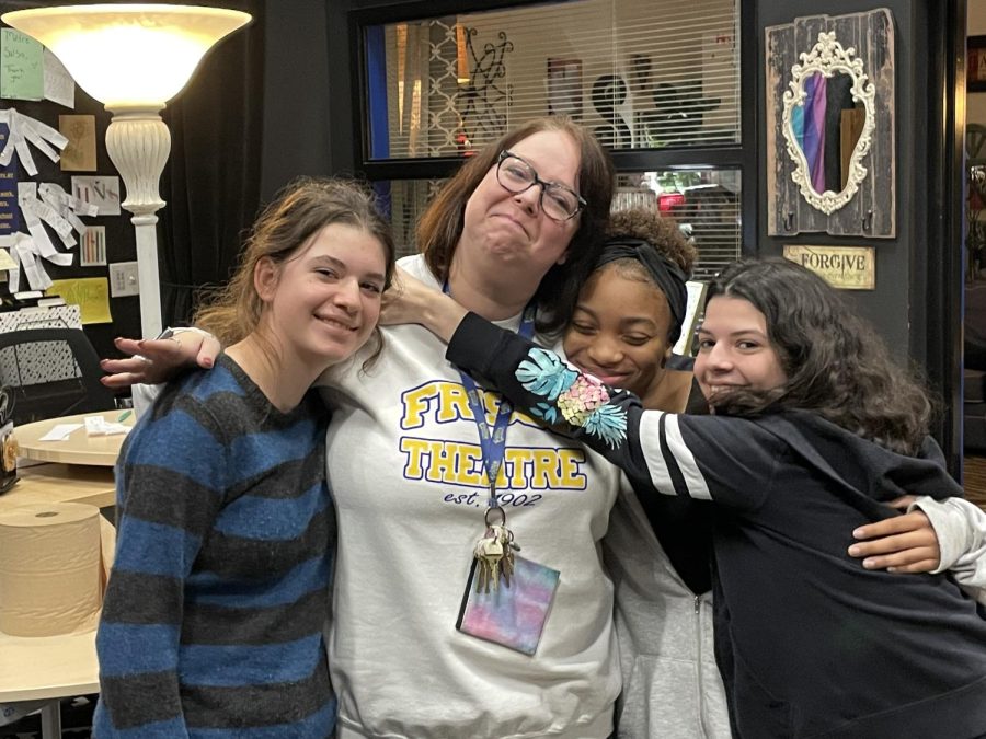 Ms. Sauls (center) with students (left to right) Emma, Zee, and Nic.