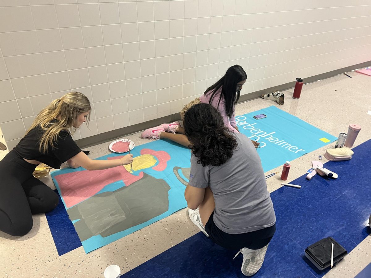 Students work on dress-up day posters