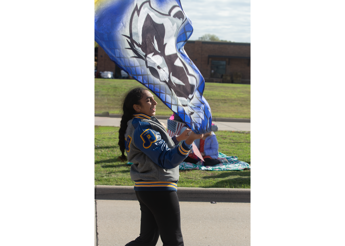 At the Frisco Community Parade, colorguard member, sophomore Misha Patel, trailed along as the last of the group, trying to avoid all spite of the flag blowing into her face. It felt like I was walking a red carpet, Patel said. Spectators were just watching us. It was weird, but nonetheless, I still dont want strangers to see me struggling to take the flag off my face.