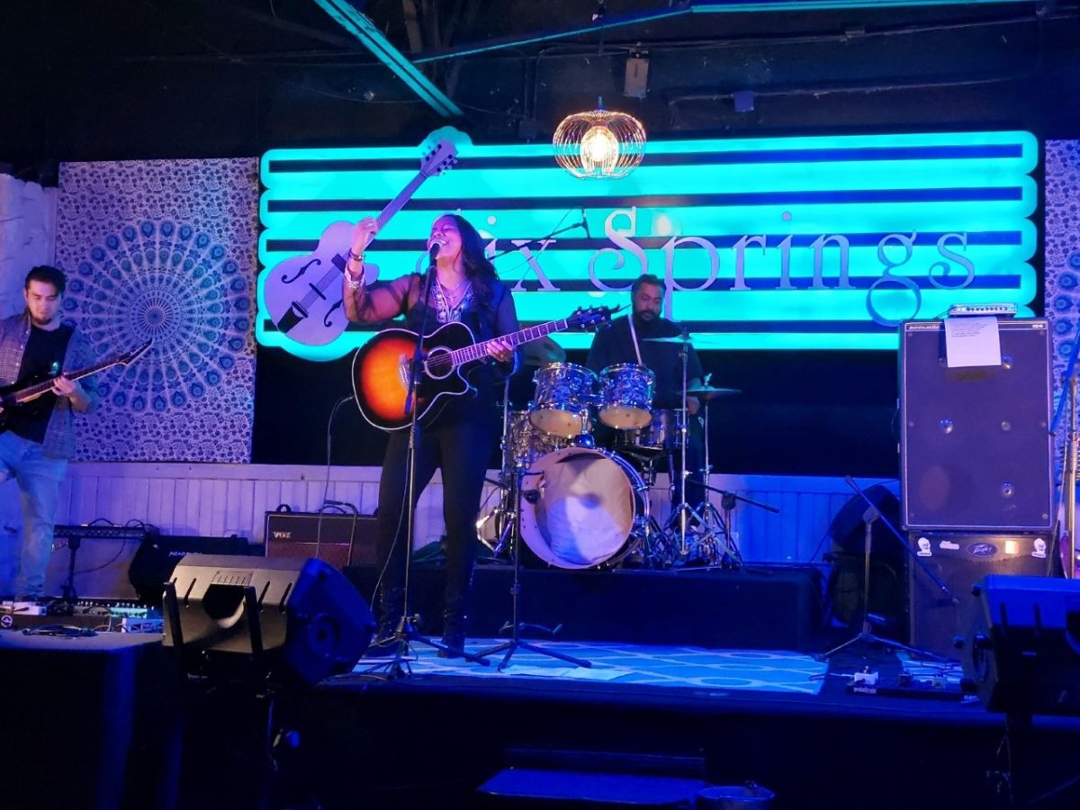 From left to right, Beyond Destinys bass guitarist Ryan Brady, vocalist and guitarist Nicole Heath and drummer Larry Logan Sr. perform a set at Six Springs Tavern.