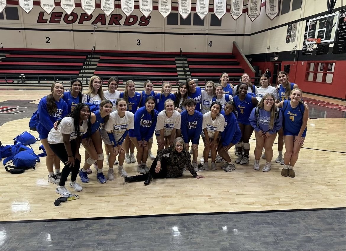 The varisty volleyball team poses at the first round playoff game on Nov. 5. 